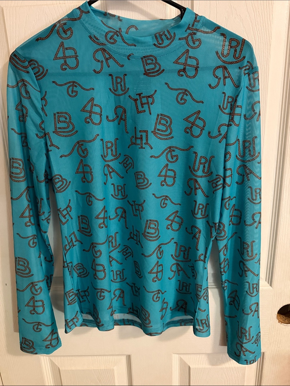 Lucky & Blessed Turquoise Long Sleeve Mesh Top with Brown Letter Print